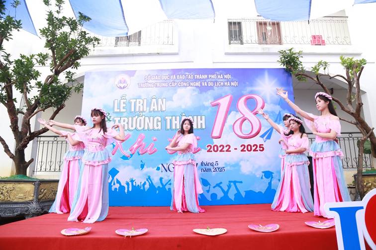 A group of women in pink dresses on a stage

AI-generated content may be incorrect.